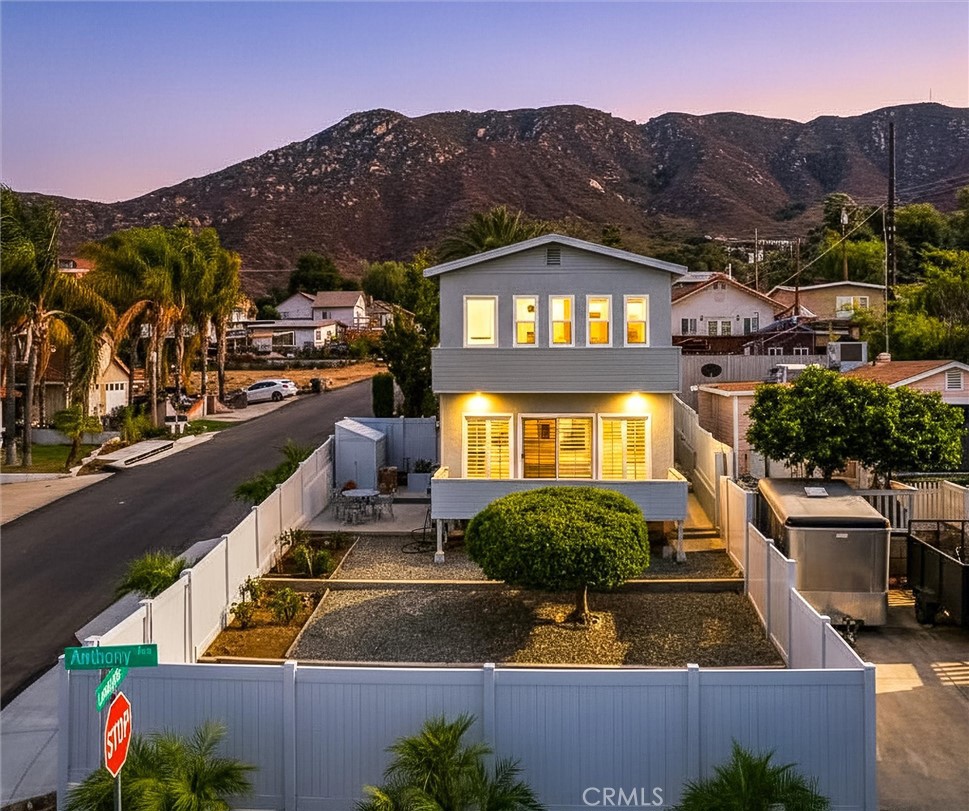 Welcome to your own piece of paradise! This stunning, turnkey home offers spectacular views of Lake Elsinore and the surrounding mountainside.
As you step inside, you'll immediately be impressed by the extensive upgrades. The **kitchen** is a chef's dream, featuring beautiful marble flooring, granite countertops, and upgraded cabinetry. The flooring throughout the home is a mix of high-quality materials, including bamboo, laminate, and more of that beautiful marble.
The **living room** is the perfect place to relax, with a huge window that perfectly frames the breathtaking lake view, bringing the tranquility of nature right into your home. Step outside onto your **private deck** to enjoy breakfast with a view that will never get old. The primary bedroom also has a second-story deck with the same incredible views.
The **spacious primary bedroom** boasts newer, upgraded flooring and is a peaceful retreat. This home also includes **plantation shutters**, upgraded countertops, and vinyl fencing around the entire property.
You'll have plenty of space for your vehicles and toys with **RV parking** on a separate driveway and room for four cars on the main driveway. The best part? There's **NO HOA** and **LOW TAXES**! This is truly the best-priced home in Lake Elsinore with these stunning views.
Don't miss your chance to make this gorgeous home yours!