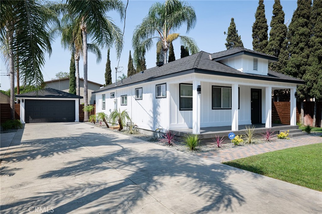 Welcome to this highly remodeled charming craftsman-style home in the beautiful city of Orange. This delightful residence seamlessly blends classic character with modern upgrades. This is a prime property as the zoning is R-3 with the potential of adding 3 other units or ADU's (buyer to verify with the city). The 9,425 square foot lot is rare to find especially with a home that has been recently remodeled. Enjoy sunsets from your porch, cozy fires in the great room and entertaining guests on the deck and large backyard. The recent remodel includes a luxurious kitchen with shaker cabinets, an island, quartz counter tops and backsplashes and stainless steel appliances. This home has been practically all redone from top to bottom including the roof, siding, front patio, flooring, kitchen, bathrooms, bedrooms, lighting, heat producing electric fireplace, inside laundry, tankless water heater, garage and landscaping. The primary bedroom is an en-suite with a private bath. All bathrooms have been completely remodeled and have cultured marble counter tops. There is a long driveway to park multiple vehicles with RV parking potential. The detached garage that has multiple possibilities including a workshop, game room, gym or parking for more vehicles. Just minutes from the Orange hills, Chapman College and the world famous Orange Circle or Plaza, the location is superb. There are views of the Orange hills and a gated community built in the last 8 years across the street. The freeway access is fantastic and there is easy access the 55, 22, 91, 57, 5 and the 261 and 241 toll roads.