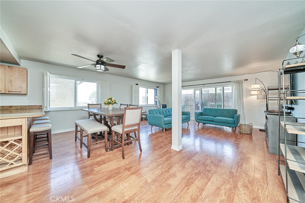 Welcome to one of the largest and most private corner end-units in a quiet, 18-residence community! Tucked into the back of the complex, this bright, breezy single-level home offers nearly 1,400 sq ft of living space with three generously sized bedrooms, no stairs, and an inviting open-concept layout. Set high on a hill, it enjoys ocean breezes, peek-a-boo views, and a private balcony—perfect for relaxing evenings. Inside, you'll find newly upgraded laminate flooring in all bedrooms, replacing the original carpet with a fresh, modern look. The primary suite features a remodeled bathroom with a waterfall shower, brand-new vanity, and a spacious step-in shower, while the secondary bath includes an updated vanity with modern finishes. The kitchen is a delight, featuring brand-new Samsung appliances—including a gas stove, microwave, and Bespoke refrigerator—along with granite countertops, ample cabinetry, a pantry with rollout shelves, and a built-in wine rack. Laundry is made easy with a new LG ThinQ stackable washer and dryer, and a newer electrical panel provides peace of mind. Additional highlights include two side-by-side garage parking spaces, private storage, and a pet-friendly community. Located near Ports O’ Call, the Korean Friendship Bell, scenic parks, and great local dining, with easy access to the 110 & 710 freeways, this home offers comfort, convenience, and coastal charm—all in one.