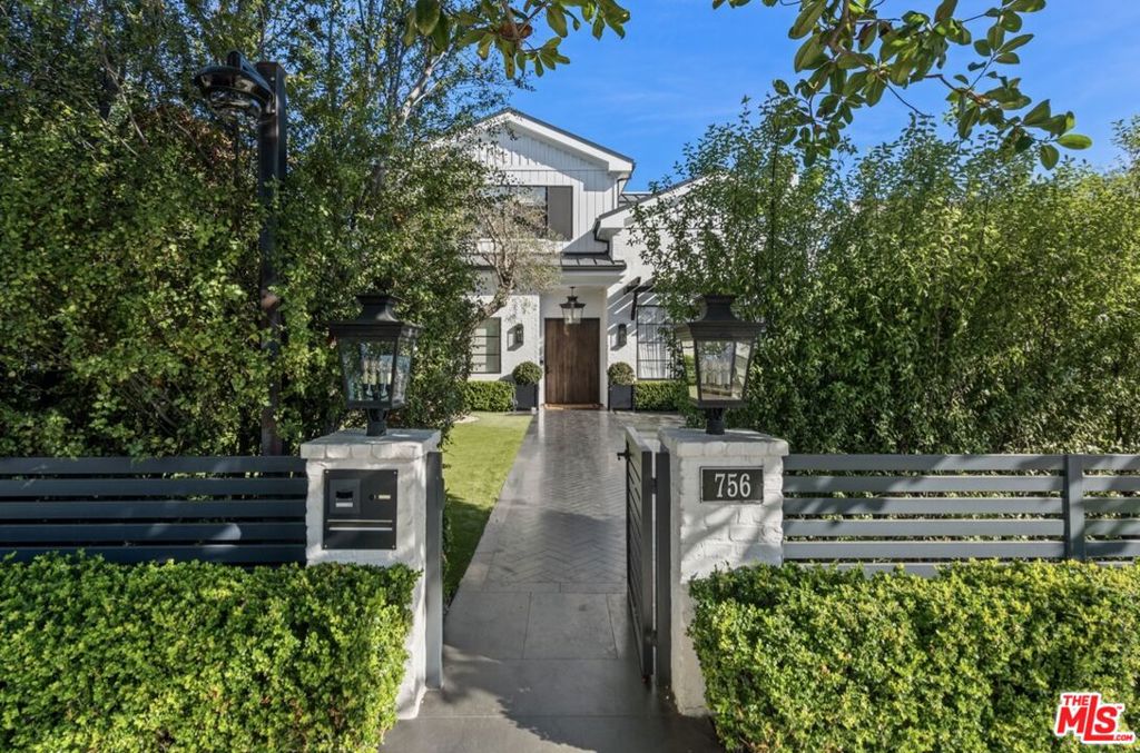 An exceptional residence with remarkable quality and custom finishes throughout. Located near the Palisades Village and scenic coastal bluffs, this home epitomizes an exquisite fusion of elegance and contemporary amenities within a prestigious enclave. The open floor plan blends indoor-outdoor living for the ultimate entertaining experience. A gracious living room leads to a chef's kitchen with top-of-the-line appliances and a large center island. Floor-to-ceiling glass doors open to the backyard, pool, BBQ, and pizza oven. With four en suite bedrooms, two offices, a gym, sauna, theater, bar, wine room, and a rooftop terrace, this home offers a comfortable and luxurious lifestyle.