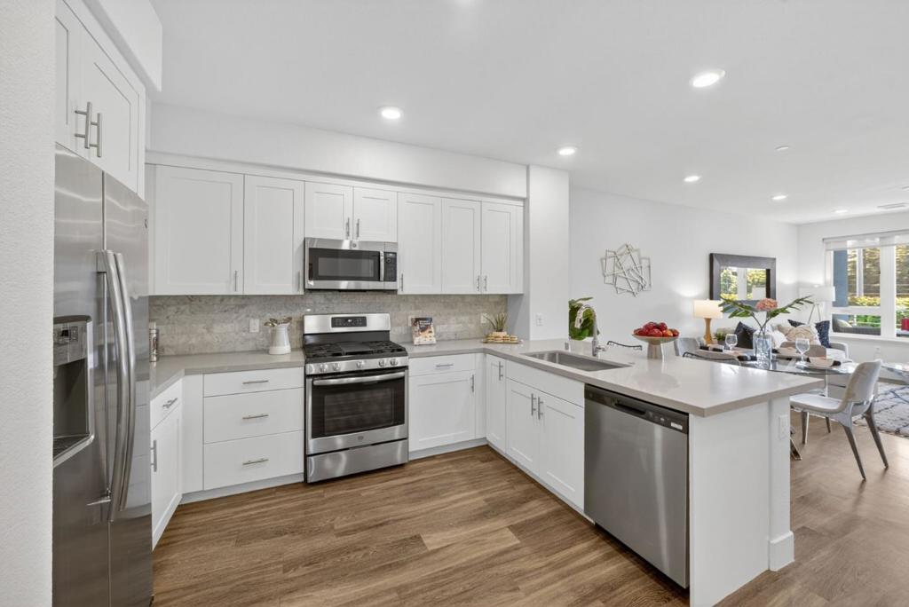 ALL OF THIS UNDER $600k!!! Lennar's First Wi-Fi Certified Home - Check Out This Smart Condo In The Sophisticated Avenue One Community - It Still Feels Brand New!! NO STAIRS Getting To Or While Inside The Home. High Ceilings, Tall Windows & Lots Of Light w/ Great Flow Throughout Makes This Home Feel Much Larger - COME SEE IN PERSON!!! Stunning White & Bright Kitchen w/ Quartz Counters & Huge Island/Breakfast Bar, Custom Cabinets & Pull Out Drawers, SS Appliances Incl 6-Burner GAS STOVE. View Of The Hills From Your Primary Suite, Large Windows, Walk-In Closet, Extra Side-by-Side Closet. Attached Bathroom w/ Lg Walk-in Shower, Dual Vanities. CAT6 Wiring, AT&T Fiber Ready For High-Speed Internet. SMART FEATURES: Smart Lights/Switches, Echo Show, Echo Pop, Sonos Speaker, Smart Thermostat & More! Secure Building Access Through Lobby & Secure Parking Garage Too w/ Assigned Parking & EV Charging Station! Community Has 12k Luxury Club w/ Giant Pool, Spa, Gym, Weight Room, Event Center (Can Rent For Private Events), Lounges, Fireplaces, Yoga Room & More! Community BBQ/Picnic Areas, Playground & Community Gardens! Next To Several Parks, Outdoor Rec, Shopping & Dining! Quick Access To 85/101 or VTA Light Rail. About 5MilesTo Silver Creek & 11 Miles From Downtown SJ, Campbell & Willow Glen.
