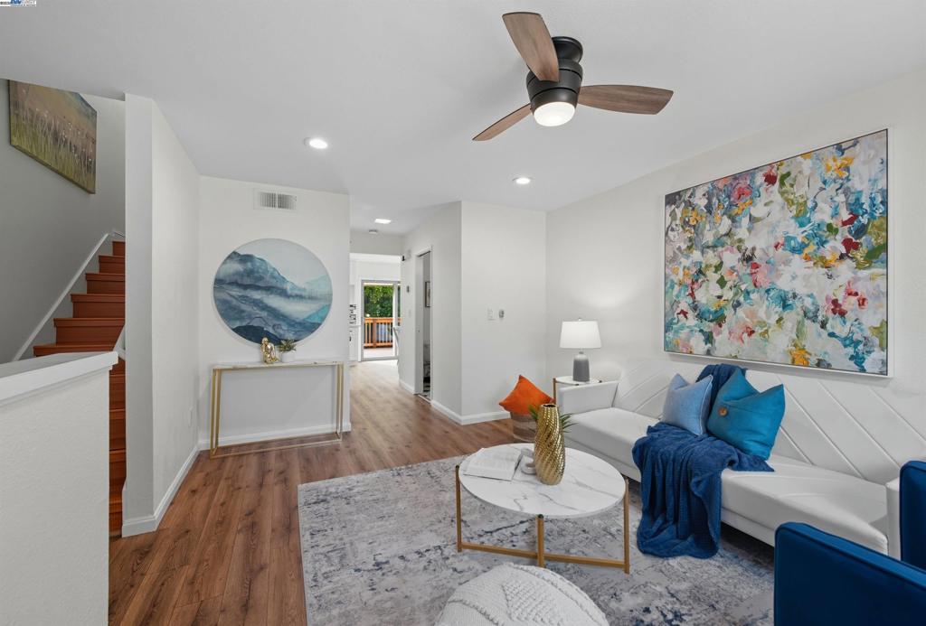 North-East facing MOVE-IN READY townhome in Fremont’s highly sought-after IRVINGTON neighborhood! This UPDATED home features a modern open floor plan with 3 bedrooms, 2.5 baths and a BONUS flexible room. KITCHEN REMODELED in 2022 showcasing quartz countertops, stainless steel appliances, and CONTEMPORARY white cabinetry. Enjoy the light-filled living and dining areas that flow seamlessly to a newly refreshed low-maintenance OUTDOOR DECK, perfect for relaxing or entertaining. Upstairs, find SPACIOUS BEDROOMS including a comfortable primary suite with large double closet space. Two other bedrooms share an UPDATED BATHROOM in the hallway. CENTRALLY HEATED and COOLED, DOUBLE-PANE windows and WOODEN FLOOR throughout the property for ease of maintenance. A versatile BONUS room on the garage level provides the ideal setup for a 4TH bedroom, kids’ playroom, private home office, or fitness studio. Conveniently located near TOP Irvington Schools, BART, Lake Elizabeth, Pacific Commons, I-880 & I-680 freeways, and major Silicon Valley TECH CAMPUSES, this home is designed for today’s lifestyle with flexibility and comfort in mind.
