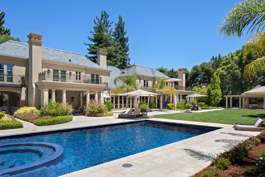 Privately positioned on just over one acre in a premier Menlo Circus Club location, this 3-level residence, exudes chic sophistication and modern elegance. Neutral colors and rich mahogany allow furniture, lighting and art to be the focal point of each room. 5 bedroom suites - one on the main floor and 4 up including the elegant master suite. The lower level includes a wine cellar by Paul Wyatt, theatre by Russ Berger, rec room with built-in media center and full bar, and a fitness center with mirrored walls and spa bath with separate steam and shower rooms. Resort-like grounds feature a pool/spa, sweeping limestone terrace, pool house with full bath, barbecue and fireplace pavilions. Additional amenities include metal framed windows and doors in Kitchen/FR by Hopes, retractable electronically controlled sun shades in the public rooms, two 2-car attached garages with epoxy flooring, and built-in cabinetry. Menlo Park schools