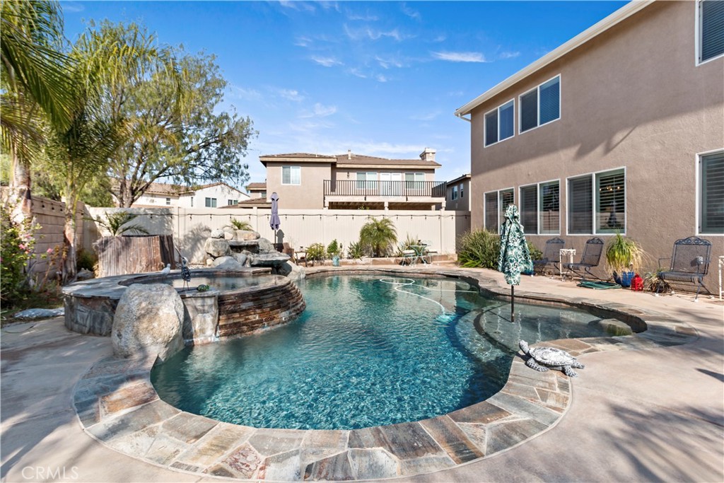 Welcome to this stunning Pool Home located in the highly sought-after Copper Canyon community of Murrieta.
Ideally situated near top-rated schools including Cole Canyon Elementary and Murrieta Valley High School, this home also offers convenient access to shopping, golf courses, and outdoor recreation.
Step inside to a formal entry that opens to a Spacious and Well-designed Floor Plan featuring High Ceilings, Crown Molding, Upgraded Flooring, and Custom Paint Throughout. Just off the entry, you'll find a Formal Living Room that flows seamlessly into the Formal Dining Room—an ideal space for gatherings and entertaining.
The beautifully Upgraded Chef’s Kitchen is the heart of the home, featuring Granite Countertops, Stainless Steel Appliances, a Large Kitchen Island, and a Built-in, Cabinet-depth Refrigerator. The kitchen opens up to a Spacious Family Room, creating a warm and open atmosphere perfect for everyday living.
The main floor offers two bedrooms, including one currently used as a home office, and a full bathroom—ideal for guests or multigenerational living. Upstairs, the primary suite features a generous retreat area with a cozy fireplace and an ensuite bathroom. Three additional spacious bedrooms are also located upstairs, including one with its own private bathroom and two that share a full hallway bath.
An added bonus is the converted 3-car garage, offering a flexible space that can be used as a home gym, game room, media room, studio, or even a private workspace—perfect for today’s lifestyle needs.
Step outside into a beautifully designed backyard that’s perfect for both relaxation and entertaining. The Custom Pool and Spa serve as the centerpiece of the space, surrounded by a Spacious Concrete Patio ideal for gatherings and outdoor dining. A Retractable Awning provides shade and comfort, making this yard as functional as it is visually appealing. Whether you're hosting a barbecue or enjoying a quiet evening, this backyard offers the perfect setting.
Additional highlights include paid-off solar 42 panels, a brand new whole-house water filtration system, two newer A/C units installed just three years ago, Pebble Tec Pool Finish, Rain Gutters and Plantation Shutters.
This well-maintained home offers quality, space, and flexibility in one of Murrieta’s most desirable neighborhoods. A must-see!