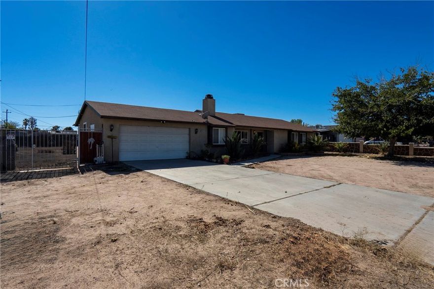 Welcome to 18401 Westlawn Street in Hesperia. Built in 1999, this single-story home features 4 bedrooms and 2 full bathrooms across a comfortable floor plan. The property sits on a large 20,350 sq. ft. lot, offering plenty of room for parking, storage, or future use. Additional features include solar panels for energy savings and a water filtration system. RV access leads to the backyard, providing flexibility for recreational vehicles or equipment. Conveniently located near the Hesperia Golf Course and a short drive to local hiking trails. A solid home with great space inside and out.