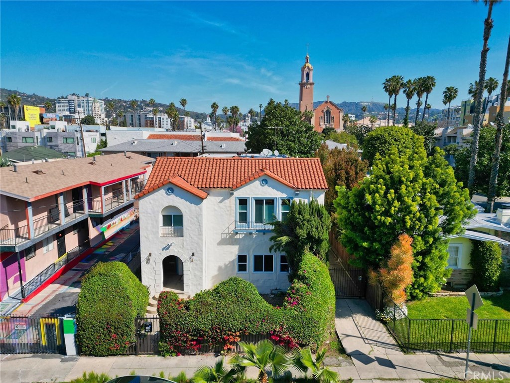 RARE HOLLYWOOD INVESTMENT OPPORTUNITY!
Welcome to this beautifully maintained Spanish-style duplex in the heart of Hollywood — just moments from Highland Avenue and the Red Line subway station. This exceptional property offers two distinct units, each with its own address: 6669 De Longpre Ave. and 6671 De Longpre Ave., totaling approximately 3,380 sq ft of living space. The first-floor unit features 2 spacious bedrooms and 1 bathroom, and is in move-in condition for a new owner or potential tenants. The second-floor unit offers 2 bedrooms, 2 bathrooms, and a versatile den ideal for a home office. It is currently rented at $4,050/month, providing immediate income. Abundant natural light pours in through large windows. Each unit is approximately 1,700 sq ft and includes its own detached one-car garage.
The property sits on a generous 6,000+ sq ft lot zoned LARD1.5, offering future development potential. A permitted Accessory Dwelling Unit (ADU) adds even more value and opportunity. Under current RD1.5 zoning, there is potential to build two additional units, making this a prime opportunity for investors or owner-users seeking both passive income and long-term growth. Whether you’re looking to live in one unit and rent the other, accommodate multi-generational living, or lease both units, this property offers incredible flexibility.
Located just steps from Sunset Blvd, near De Longpre Park, Universal Studios, restaurants, entertainment venues, and shopping — this is an unbeatable location in one of LA’s most iconic neighborhoods.
Don’t miss this rare opportunity to own a high-demand, income-generating property in the heart of Hollywood!