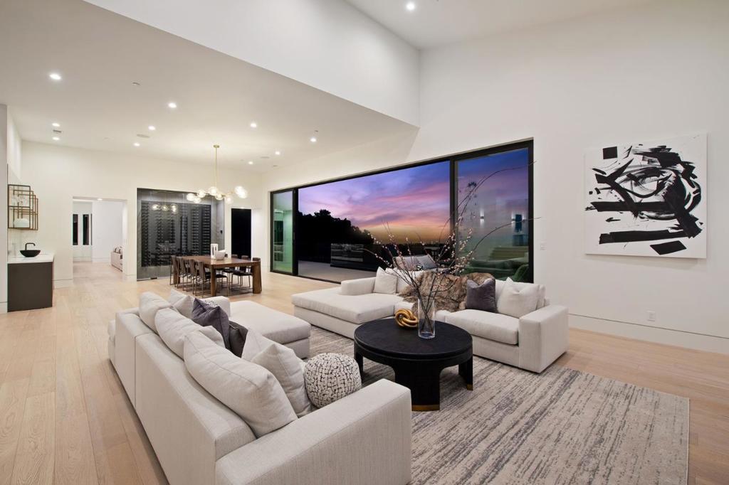 A Stunning Example of Architectural Perfection | This Newly Rebuilt Home is Sure to Take Your Breath Away | Unobstructed Bay and Canyon Views | Main House 6 BD and 5.5 BA | Studio Guest House | Miele Appliances | Waterfall Marble Kitchen Island | 378 Bottle Temperature Controlled Wine Display | Grand Entry | High Ceilings | Open Floor Plan | Italian Poliform Cabinetry | European White Oak Hardwood Floors | Exquisite Marble and Stone Throughout | Distributed Audio System | Prewired Surveillance System | Network System for Entire House | 3 Car Garage | EV Charging Plug | 4 Zoned Heating and Cooling System | LED Lighting Throughout | Office with Builtins | Movie Room with Surround Sound System | Western Windows | La Cantina Sliders | Luxurious Indoor/Outdoor Living | 2,000+ SF of Decking | Large Backyard with Grass | Room for a Pool | Views from Every Window | Treat Yourself to an Elevated Lifestyle Most Can Only Dream Of | This Home Has Everything For The Most Discerning Buyers.