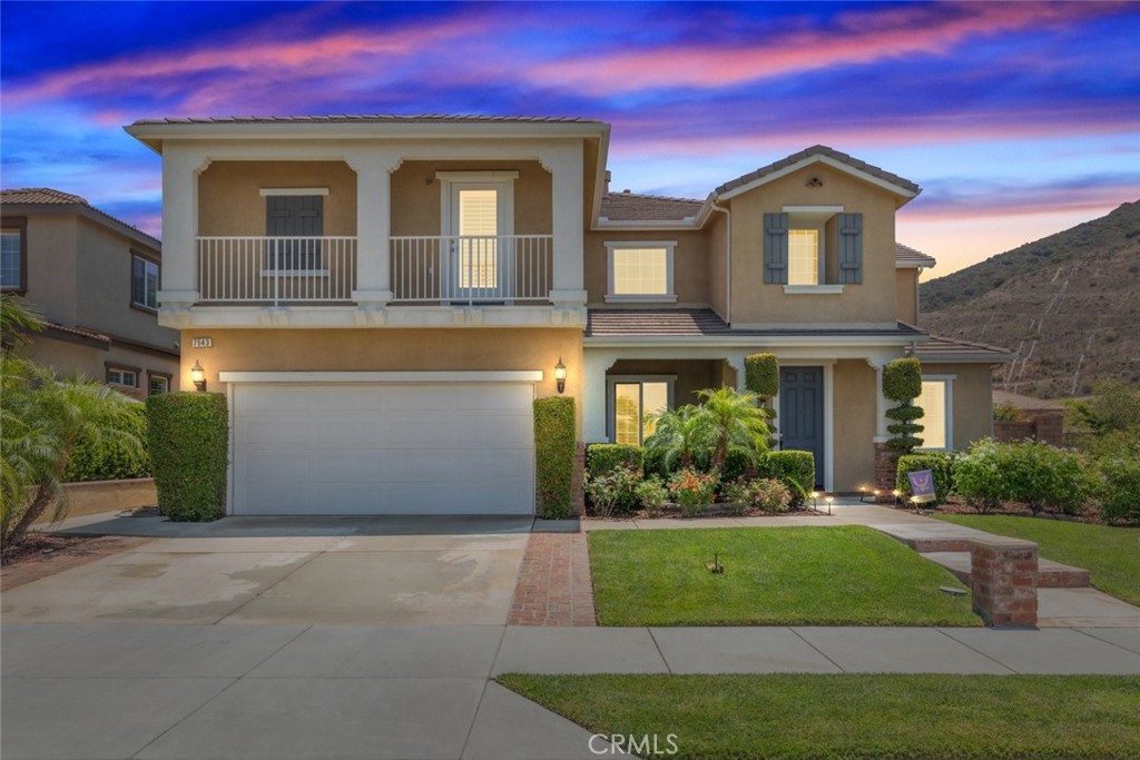 Located in the prestigious, guard-gated community of The Retreat, this executive home offers breathtaking mountain views with no neighbors across the street—just open space and natural beauty. With exceptional privacy and curb appeal, this residence stands out in one of South Corona’s most sought-after neighborhoods.
Step inside to find plantation shutters and ceiling fans throughout, along with formal living and dining rooms ideal for entertaining. A wide staircase with custom wrought iron banister leads upstairs, while the main level features upgraded flooring and flows into an upgraded kitchen with expansive counter space, a large food pantry, Butler’s pantry, and included refrigerator. The adjacent family room showcases a custom stone accent wall, adding warmth and character.
This home offers dual primary suites for ultimate flexibility. The upstairs primary suite is a true retreat, complete with a cozy fireplace, spacious sitting area, large walk-in closet, and private balcony with sweeping mountain views. The downstairs en-suite bedroom includes a full bath along with a built-in refrigerator and microwave—perfect for guests, multigenerational living, or an in-law setup.
A large upstairs loft offers additional living space, while a linen closet, powder room, and a laundry room with sink add everyday convenience. Washer and dryer are also included. The additional guest bedrooms are generously sized to accommodate a variety of needs.
The backyard is designed for relaxed outdoor living, featuring a California room, Alumawood patio cover, built-in barbecue, gas fire pit, and blooming rosebushes. The three-car garage offers built-in storage cabinets and ample space.
With no neighbors on one side or across the street, this home enjoys rare privacy. Community amenities included a guard-gated entry, low HOA dues, and low taxes. Located close to top-rated schools, the 91, 15, 71, and 241 freeways, Foothill Expressway, Dos Lagos, and The Crossings shopping centers.