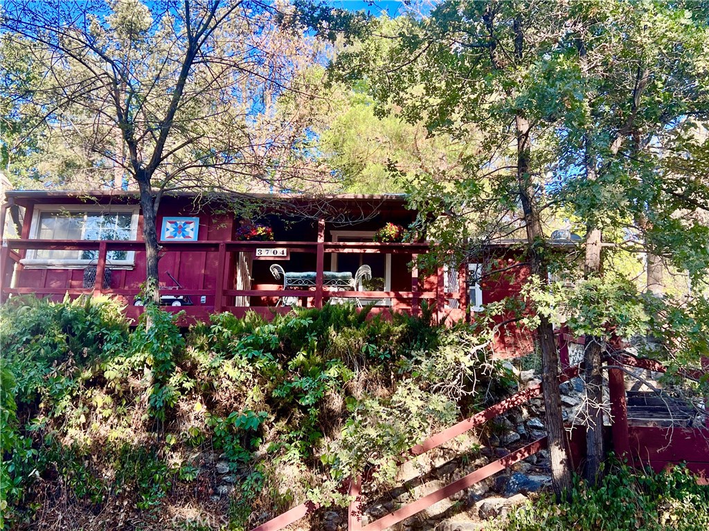 DARLING 1930'S COTTAGE WITH HISTORIC CHARM IN GREAT LOCATION! Come view this one bedroom, one bath with loft. It takes you back to a simpler time with a rustic stone fireplace, interior board and batten walls and an inviting covered front porch. The back yard offers an upper garden area that has beautiful mountain views, fruit trees and a garden shed. Located close to the community park, library and post office in a quaint mountain community where you can enjoy the 4 seasons and a slower paced lifestyle. This would make a wonderful first home or sweet mountain retreat!