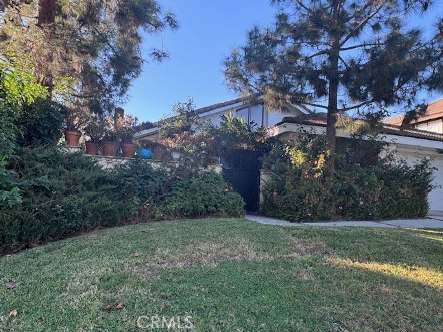 Discover your dream home in the exclusive gated community of Rolling Hills. This beautiful 3 Bedroom, 2 bath residence sits on a quiet, single loaded street, offering exceptional privacy on a corner lot. Spanning 2.048 square feet on a 7,300 square foot lot, this property features soaring cathedral ceilings and a spacious 2.5 car garage. Enjoy the newly remodeled kitchen, complete with moder finishes, and benefit from the recent plumbing upgrades for peace of mind. Nestled in a community with 40 acres of open space, residence have access to a private 5 acre park, with pools, sports courts, and scenic walking trails. Perfectly positioned for convenience, this home is just minutes from shopping, toll roads, top-rated schools, and much more. Experience the perfect blend of privacy, luxury, and accessibility in this rare single story treasure.