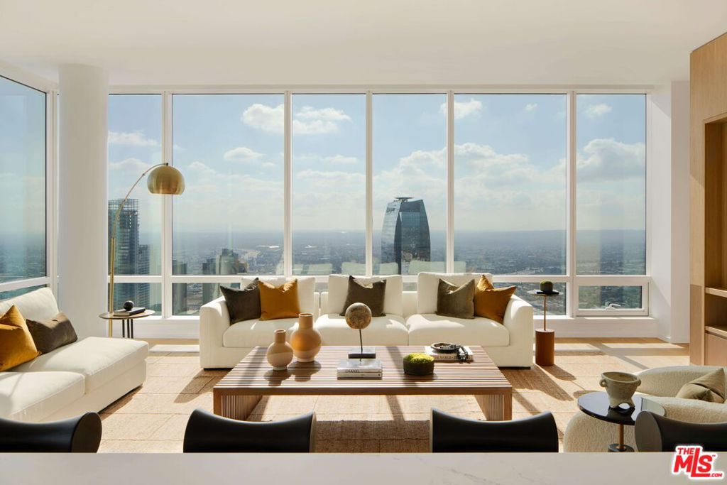 Explore the top level of luxury as a resident of THEA's impeccable penthouse residences in Downtown Los Angeles, CA, featuring open floor plans with the highest quality of finishes and detailing throughout. Selected by award-winning design teams at JG Neukomm Architecture and BAMO, the interiors are highlighted by a rich variety of natural materials, including stone combinations, solid woods, and contemporary metal finishes.Sitting 59 stories above the LA skyline, each light-filled penthouse is draped in floor-to-ceiling windows showcasing unprecedented, panoramic views of DTLA and beyond. Penthouse residents also enjoy luxury services that include complimentary valet service, housekeeping services, and a special discount at the Hotel Located within the Metropolis collection of residences, THEA provides a sanctuary for personal relaxation and lively gatherings.PENTHOUSE MEMBERSHIP include;Monthly car wash, Complimentary valet, Monthly fresh floral delivery, Monthly housekeeping, Monthly massage with Soothe.PENTHOUSE HIGHLIGHTS; Open floor plans with floor-to-ceiling windows showcasing stunning downtown views, Modern design finishes with high-end detailing throughout, Generous ceiling heights at 9 feet and up to 16 feet, Keyless technology entry, Spectrum kitchen cabinets / Austrian Bonaire kitchen and bathroom cabinets with self-closing hardware throughout, Solid wood floors, Caesarstone Countertops, Beautifully detailed chef kitchens with high-end dishwasher, refrigerator, oven, microwave, and espresso machine, Built-in kitchen islands with a waterfall countertop, Gas cooktops, Wine storage, and refrigerators, High Quilty soaking tubs, Full-size washer and dryer, Digital thermostat system, Technology integration with Smart Box for wi-fi connectivity, Motorized custom window treatmentsThis is a complete list of residential amenities, which may vary depending on the unit level.Descriptions, availability, and pricing are subject to change. Rent is based on monthly frequency. Additional fees may apply, such as but not limited to package delivery, trash, water, etc. Deposits vary. Please see the representative for details.
