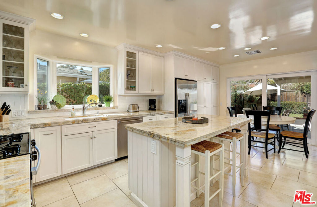 Situated in the coveted Kenter Canyon school district, this Brentwood Glen traditional blends gracious period details seamlessly with modern amenities. The spacious, sundrenched living room with generous windows flows to a formal dining room that is perfect for an in-home office. Stunning cook's kitchen features a center island, breakfast area, custom cabinets, granite counters, s/s appliances and opens to the private back yard. Designer baths feature marble counters and custom tile. A master suite, second bedroom and charming den or third bedroom create a flexible and flowing floor plan while two fireplaces, gleaming hardwood floors, and gorgeous landscaping complete this home too perfect for words. Move to The Glen and enjoy close proximity to UCLA, Westwood, the 405 and all Brentwood has to offer! Tenant is advised to conduct their own due diligence concerning school boundary lines or eligibility.