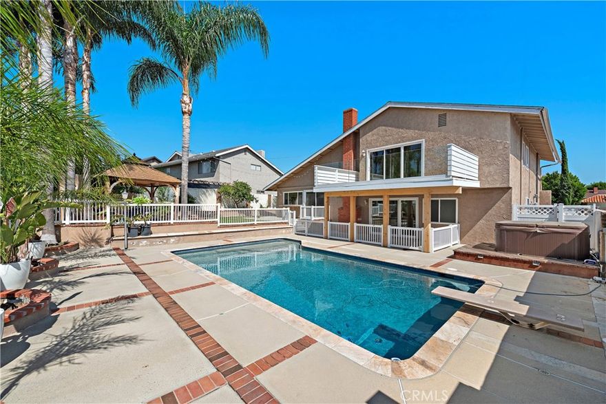 Welcome to Your Mission Viejo Oasis in Aegean Hills!



Step into this beautifully updated home in the tranquil Aegean Hills community, where soaring cathedral ceilings and an abundance of natural light create an open, airy feel from the moment you walk in.



With four spacious bedrooms and three updated bathrooms, this home offers comfort and flexibility for families of all sizes. A main-level bedroom provides convenience for guests or a home office, while the dedicated laundry room adds to everyday ease.



Upstairs, the primary suite is a true retreat—complete with a private deck perfect for morning coffee or evening relaxation. Two additional oversized bedrooms also feature deck access, inviting you to enjoy Mission Viejo’s signature sunshine year-round.



Outside, the entertainer’s backyard is your personal paradise. Surrounded by lush tropical palms and mature lemon, avocado, and peach trees, the space features a sparkling pool, above-ground spa, and a cozy gazebo with fireplace—ideal for hosting or unwinding. The gated pool area ensures peace of mind for families with children, while the meticulously maintained landscaping sets a beautiful backdrop for any occasion.



Energy-efficient solar panels help keep utility costs low, and the home’s prime location offers easy access to local shops, restaurants, parks, and the 5 Freeway—all while enjoying the peaceful ambiance of Aegean Hills.



Discover the perfect blend of comfort, style, and California living—welcome home!