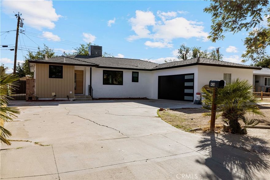 Step into modern elegance at 438 East Avenue R-5, a stunning 4-bedroom, 2-bathroom residence offering 1,301 sq ft of beautifully remodeled living space on a generous 6,970 sq ft lot. Designed with sophistication and functionality in mind, this home blends clean contemporary finishes with warm California comfort. An inviting open-concept floor plan welcomes you inside, featuring expansive natural light, stylish fixtures, and brand-new upgrades throughout. The modern kitchen showcases white oak cabinetry, sleek quartz countertops, and new stainless-steel appliances - the perfect setting for both entertaining and everyday living. The primary suite is a serene retreat, complete with a beautifully updated bathroom featuring floating vanities, elegant tile work, and designer touches. Each additional bedroom offers comfort and versatility for family, guests, or workspace. Outside, enjoy a spacious private yard ideal for outdoor gatherings, complemented by a brand-new modern garage door and long driveway for convenience and curb appeal. Located in a quiet Palmdale neighborhood close to shopping, parks, and schools, this home delivers the perfect balance of modern design, comfort, and everyday functionality - all move-in ready and designed to impress.