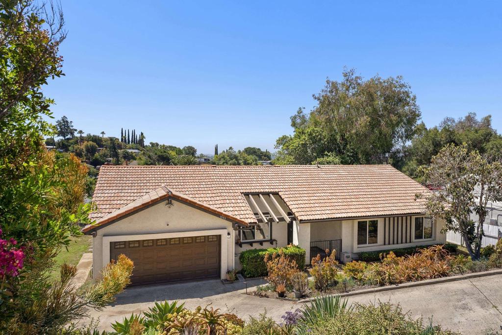 Gorgeous Turnkey Single-Story Home in North Escondido Foothills Located on a spacious 10,000 sq ft lot, this beautifully maintained single-story home offers the perfect blend of comfort, efficiency, and value. Situated at the edge of Escondido’s scenic foothills, the property is surrounded by million-dollar homes in one of North Escondido’s most desirable neighborhoods. With low property taxes and no HOA, this home is an exceptional find for the budget-conscious buyer. The drought-tolerant landscaping includes mature Meyer lemon, orange, and loquat trees, providing seasonal fruit and low-maintenance outdoor living. The home also features 18 owned solar panels—offering significant energy savings and long-term value without the burden of a lease. Inside, recent upgrades include newer vinyl windows, fresh carpeting, and a remodeled kitchen complete with granite countertops, stainless steel appliances, and a stainless farmhouse sink. The two-car garage includes interior laundry space, a water softener system, and a newer garage door. Conveniently located near the 15 freeway, the property provides easy access to nearby shopping centers, dining options, and entertainment. Whether you're commuting, working from home, or enjoying the surrounding natural beauty, this home offers comfort and convenience in a peaceful, established community. A rare opportunity to own a move-in ready home with space, upgrades, and sustainability in one of Escondido's most sought-after locations. Don't miss your chance to make this North Escondido gem your own.