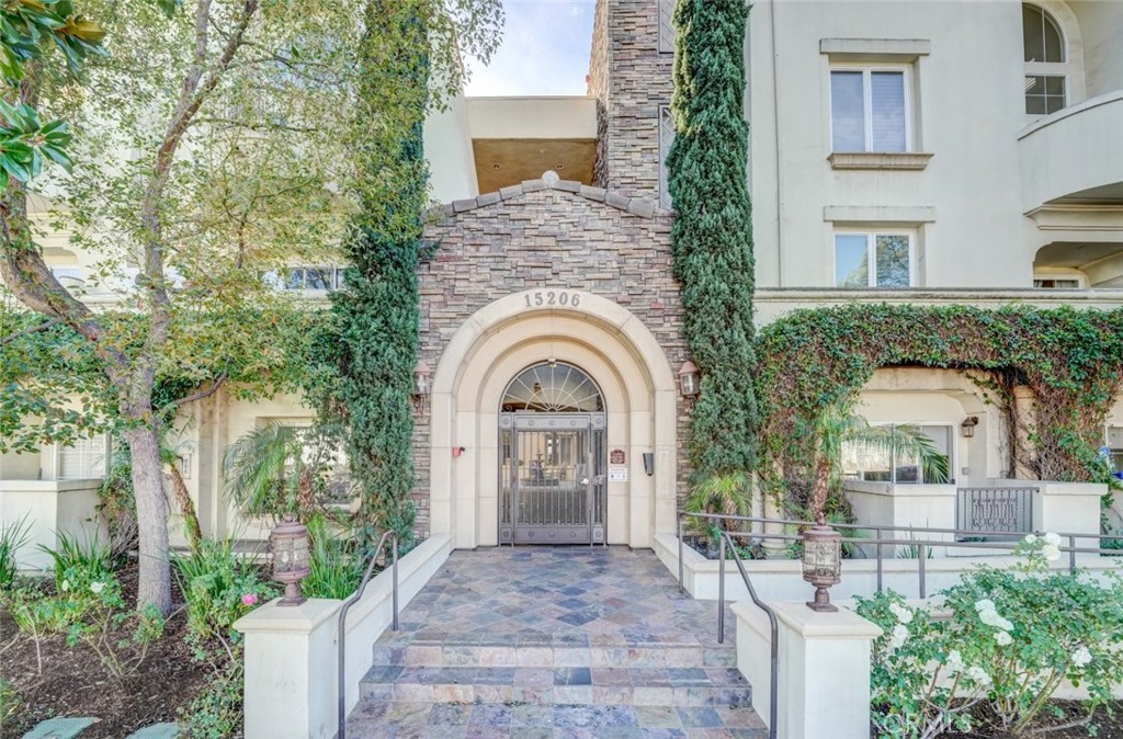 A gorgeous condo residing in the coveted Villa Trevi of Sherman Oaks! Inside this first-level home with two balconies, be greeted by a fresh and luminous 1,430-sqft floorplan detailed with vibrant chestnut laminate flooring throughout, window shutters, ample built-in storage, and recessed lighting. The open concept of the dining and living room enjoy an elegant fireplace to create a soothing ambiance and access one of the private balconies with neighborhood views. Beautifully crafted wood cabinetry and glossy granite countertops adorn this open kitchen complete with all built-in stainless-steel appliances and overlooks the dining area. Both bedrooms include plenty of closet space while the largest bedroom features a huge walk-in closet and an en-suite bathroom offering a shower, bathtub, and a double sink vanity with stone countertop. Residents are provided with a gated subterranean tandem parking for two cars and are welcome to enjoy the beautiful fountains, two courtyards with outdoor barbeques, and a soothing rooftop sun deck to unwind at. A prime location minutes away from Costco, Target, Lake Balboa, the various restaurants and shops along Ventura Blvd, and the 101 and 405 freeways. Available for lease now!