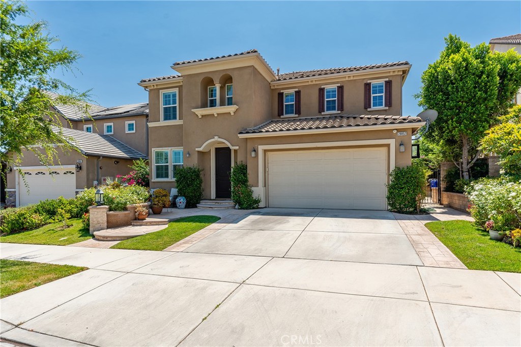 Experience refined living in this exquisite 5 bedroom, 4.5 bathroom, 3,572 sq ft residence set within the prestigious gated community of West Hills in Valencia. From the moment you enter, you’re welcomed by rich hardwood floors, elegant formal spaces, and an open layout that flows into the gourmet kitchen featuring granite countertops, a grand island, premium stainless steel appliances, built-in oven with microwave, cooktop with vented hood, and abundant cabinetry. The home offers a private downstairs suite with en suite bath and walk-in closet, while the upper level reveals a versatile loft, spacious secondary bedrooms, and a primary retreat that redefines luxury with breathtaking mountain views, an oversized walk-in closet, and a spa sanctuary showcasing a dual rainfall steam shower, soaking tub, heated towel rack, and bidet. A thoughtfully designed mud room with garage access, extensive built-in cabinetry, and a bonus walk-in closet the size of a bedroom provide exceptional storage. Outdoors, the backyard transforms into a private resort with a custom pool and spa, fire pit lounge, and covered patio surrounded by lush greenery. Residents also enjoy exclusive access to HOA amenities including multiple pools and spas, clubhouse, parks, scenic paseos, and bike trails, all within walking distance to award-winning West Creek Academy and just moments from premier shopping and dining. This residence offers the ultimate combination of elegance, comfort, and lifestyle in one of Valencia’s most desirable communities.