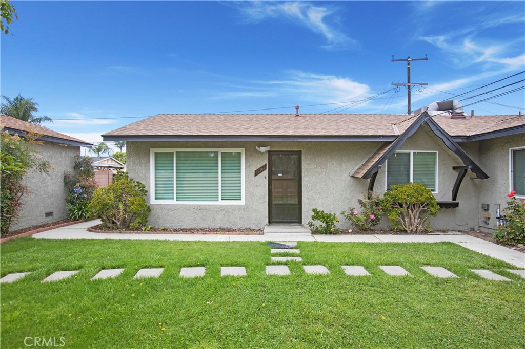 Beautifully remodeled 2 bed, 1 bath home in Paramount unit with approx. 700 sqft with Detached garage. Unit has been completely remodeled with new plumbing, electrical, flooring, fixtures, paint, quartz countertops, new stainless steel microwave and dishwasher & fridge, new stackable washer & dryer (to be installed prior to move in) Bathroom has new tub/tile, all new fixtures. Unit comes with new heating and central air conditioning and nice big front and back fenced in yard. Located within Walking distance to Lincoln Elementary, close to the 91, 710 and 105 freeways.