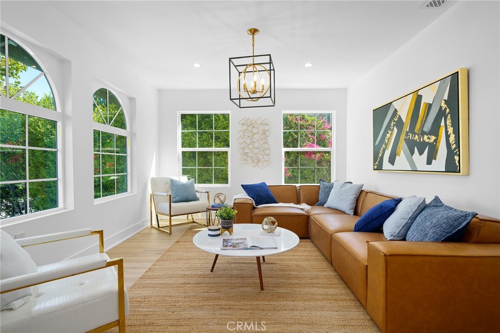 Welcome to One of Windsor Hills’ Best-Kept Secrets | Mid-City Wilshire (Hancock Park) | Spanish Modern Revival | Built 1924 | 4 Bedrooms | 4.5 Bathrooms | 2,508 Sq. Ft. Living Space (Single Story) | Approx. 6,600 Sq. Ft. Lot | Meticulously remodeled, this single-story home offers an open floor plan, perfect for today’s lifestyle | Brand-New Custom Gourmet Kitchen with Quartz Counters, White Shaker Cabinets with Under-Cabinet Lighting, and New Stainless-Steel Appliances | Each bathroom is thoughtfully designed with custom finishes | New double-pane windows throughout | All-new electrical wiring, upgraded panel, and EV 220 charger in driveway | Complete re-pipe with new plumbing | Recessed lighting and custom fixtures throughout | Beautifully refinished original hardwood floors | Custom-built-in wine rack and designer details throughout | New HVAC system with upgraded designer vents | Bonus 300 sq. ft. dry-walled attic – ideal for storage, gym, or creative space | Finished 150 sq. ft. basement for additional flexibility | Detached 250 sq. ft. casita/storage room (can be used as a 5th room, office, or studio) | Custom iron gates and railings, new exterior stucco, and elegant curb appeal | Professionally landscaped with an auto sprinkler/drip system | Located near Harold Henry Park, the Ebell Theatre, top private schools, Downtown LA, dining, and major freeways — this is a must-see masterpiece in one of LA’s most desirable historic neighborhoods.