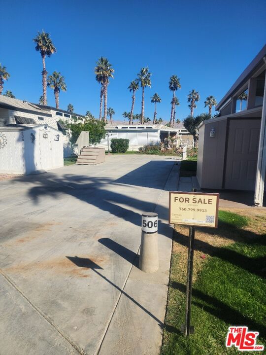 This beautiful, oversized lot over looking a water feature and the 9th tee box is a highly desired area of the park. It is ready to pull in your RV or back in your 5th Wheel and set up your home away from home. A shed is included on the property for your additional storage. A must see view. This all located in a 55+ community that has a 3 par golf course, chipping green, putting green, 9 hole mini golf, pickleball and tennis courts, bocce ball, an indoor shuffleboard courts, 2 clubhouses with pools and jacuzzies and an additional 4 satellites with pool, jacuzzies and mail boxes. This is all within a 24 hour gate guarded community of 801 lots, that consist of a combination of Park Models and RV lots, where you own the land. The resort has a limit of 270 day occupancy. It is a perfect place to spend your holidays in the sunshine.