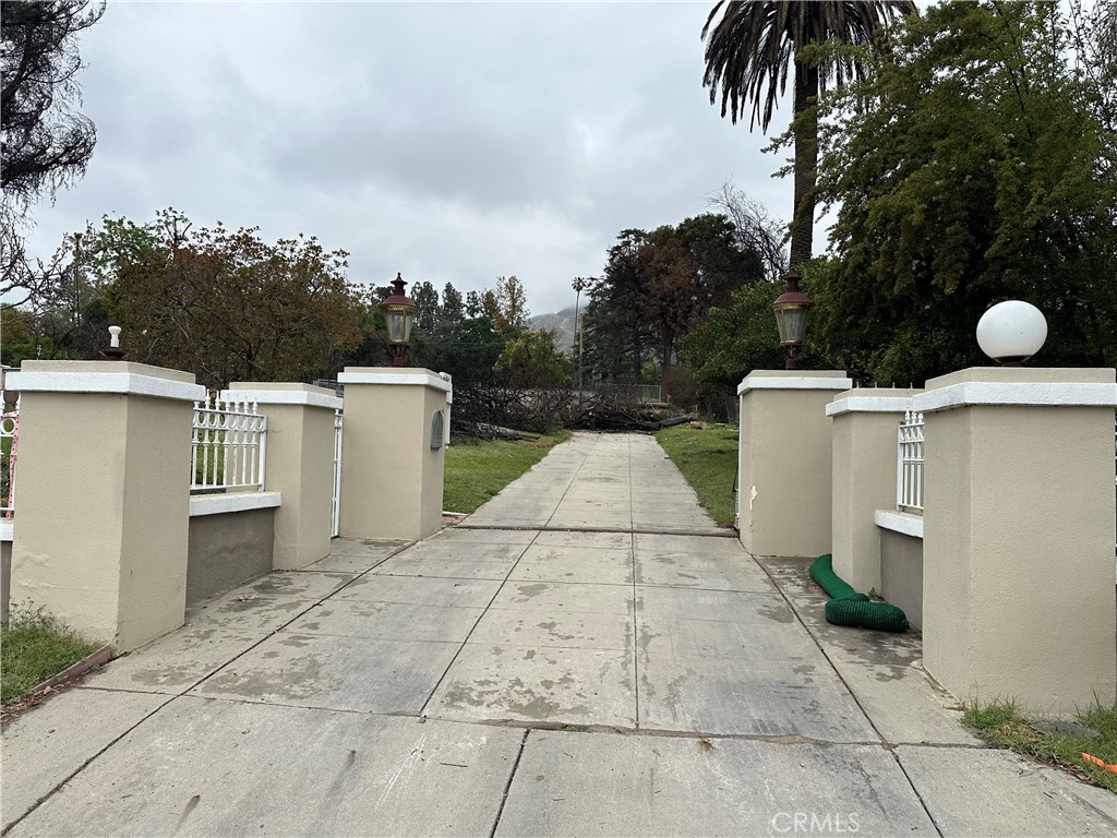 This property is an exceptional opportunity to own over 1/2 an acre of flat land in the heart of Altadena's most sought after estate area. The original gated property was destroyed in the Eaton Canyon fire and featured 4 bedrooms, 3 bathrooms, a five car detached garage, workshop, and 3,333 sq. ft. of living area with a lot size of 22,405 sq. ft. (100/226 sq. ft. deep). This is a chance to create something truly special on a unique and very large lot in an incredible neighborhood. This property is located just minutes away from Altadena Country Club. Please note, it is being sold in its as-is condition. Phase 1 and 2 have been completed. Buyers will need to verify the current status with local providers pertaining to all utilities. We encourage interested parties to perform their due diligence on zoning, permits, and rebuilding requirements with Los Angeles County. Per sellers the property has 4,133 sq. ft. Assessor records show 3,333 sq. ft. Please do not walk on the property, drive-by only. Please contact listing agent Joycelyn McDowell for more information.