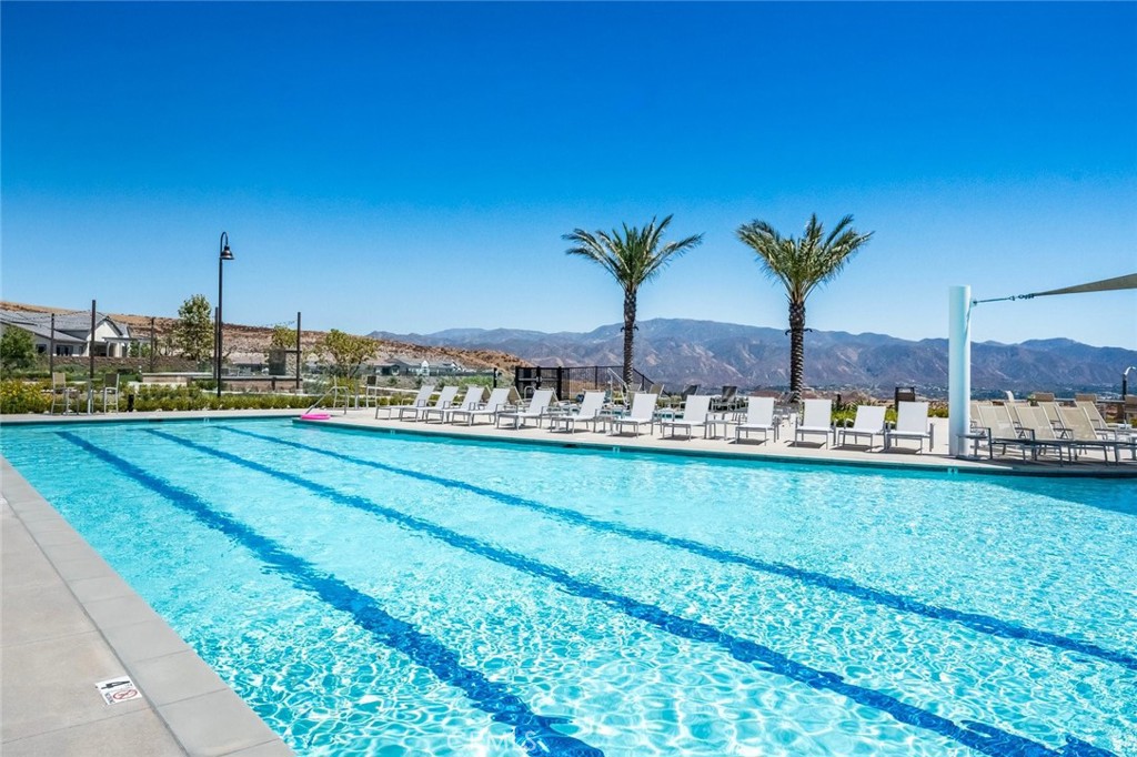 Spectacular Gated Single Story Entertainer’s Home with Stunning Mountain Views located on a Cul-De-Sac in the Desirable Altis at Skyline Active Adult Community! This Stunning Home Boasts with Approx. 1,700 Sq. Ft., 2 Large Bedrooms, Plus Den (Could be Office) with High Ceilings, 2 Bathrooms, Gorgeous Chef’s Kitchen with Quartz Counters, Gorgeous Backsplash, Stainless Steel Appliances, Walk-In Pantry & Oversized Quartz Island Breakfast Bar with Sitting Area. Perfect for any Chef! Fabulous Dining Area and Large Great Room with Sliding Doors to the Large Upgraded  Cover Patio and Professionally Landscaped Backyard. Great for Family and Friends Gatherings! Plenty of Room for the Grandkids to Play & Have Fun! Large Primary Bedroom with Large Walk-In Closet. Luxurious Primary Bathroom with Quartz Counters & Huge Walk-In Shower. Feels like a Spa! Features include Upgraded Flooring, Recessed Lighting, Indoor Laundry Room, Quartz Counter Tops & Professionally Painted. Private Backyard with Large Covered Patio, Professionally Hardscaped & Landscaped. Feels like you are at a resort! 2 Car Garage with Direct Access. This Living Smart Home is Eco-Friendly with Smart Doorbell, LED Lights throughout & Paid Solar Panels saving you Thousands of Dollars. Altis 55 Plus Resort Style Community Amenities include, Pool, Spa, Hot Tub, BBQ, Pickleball Courts, Putting Green, Clubhouse with Gym, Workout Studio, Game Room, Lifestyle Director with monthly community activities, trails and much more… Feels like you are on a Cruise Ship! Close to Shopping, Restaurants & Easy Freeway Access. No Mello Roos.