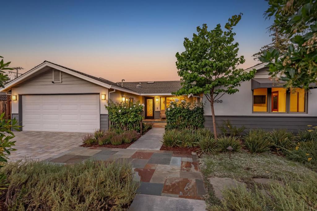Nestled in the highly desirable Daves Avenue neighborhood, this stunning single story Craftsman style home was masterfully rebuilt in 2017 w/ nothing but the finest materials. An abundance of cherry wood cabinetry, doors and trim are displayed throughout the well thought out 4 bedroom, 2.5 bath home. The 4th bedroom is currently being used as an office w/ built in bookcase in the closet & retractable bifold doors providing an indoor/ outdoor experience. Cherry trimmed coffered ceilings in the living rm, family rm and owners suite give a feeling of airiness. The well appointed chef's kitchen features high end stainless appliances, a walk-in pantry, beautiful leathered granite counter tops along with an eating island, prep sink & wine fridge and opens on to the dining space & family room. You may never leave your luxurious owners suite w/ a gas fireplace, free standing tub, gorgeous steam shower, walk-in closet & cherry wood slider to the private rear yard with a hot tub. The drought tolerant grounds are a true work of art with blue stone patios, seat walls, wisteria covered pergola, fruit trees, raised planter beds, a paver driveway & a private courtyard entry. Lutron lighting, white oak hardwood floors throughout & an indoor wine & laundry room. Top rated Los Gatos schools!