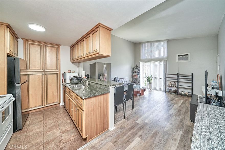 Step into your own private sanctuary in this quiet and private top-floor end unit, tucked away in one of the most desirable corners of the gated Mariner’s Park Village community. With no neighbors above or below, this 1-bedroom, 1-bath condo offers the rare combination of serenity, security, and style. You’re welcomed by a sense of openness by a high vaulted ceiling. The spacious living area leads to a charming private balcony, perfect for morning coffee, reading, or simply relaxing in your own outdoor escape. The balcony is also accessible from the bedroom, making it an extension of your personal haven. The kitchen is well-sized and functional. Additional features include gated community, laundry room right downstairs, location is shielded from freeway noise, ocean breeze, assigned carport parking space with outdoor storage. Community amenities are Beautifully maintained park-like grounds,2 swimming pools, clubhouse, playground. HOA covers hot and cold water, too. Invest in comfort, style, and a place to call your own.