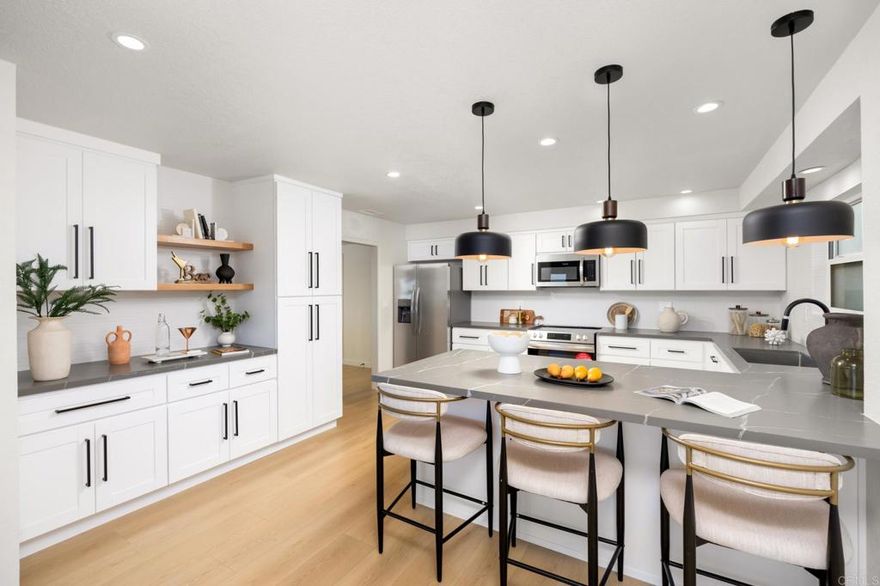 Views & Modern Coastal Living in South Redondo! This fully remodeled two-story home pairs contemporary design with everyday comfort in one of Redondo Beach’s most desirable neighborhoods. The sunlit upper level features wide-plank oak floors, a sleek fireplace, and glass sliders opening to a balcony with stunning vistas—ideal for morning coffee or sunset gatherings. A designer kitchen boasts quartz counters, matte black hardware, pendant lighting, and stainless appliances, flowing seamlessly into the dining area. Downstairs, the primary suite offers patio access and a spa-inspired bath with brushed brass fixtures and a walk-in shower. Three additional bedrooms add versatility, while the private backyard with tiered deck and lounge areas sets the stage for effortless entertaining. Moments from Riviera Village, award-winning schools, and the beach.
