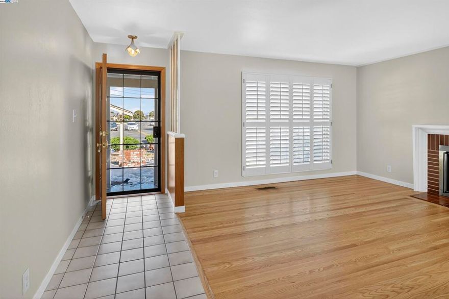 Come see this lovely home in the desirable Washington Manor area. Step inside to discover refinished hardwood floors and a cozy wood-burning fireplace that create a warm, inviting living space. The light and bright kitchen features freshly painted cabinets and plenty of storage. Additional highlights include a spacious primary bedroom suite, dual-pane windows, and classic plantation shutters throughout. Enjoy the low-maintenance, drought-tolerant front yard and relax under the covered patio in the private backyard — perfect for outdoor entertaining. With a new roof, fresh interior paint, and a convenient location close to shops, restaurants, and scenic Bay Trails, this move-in ready home is a must-see!