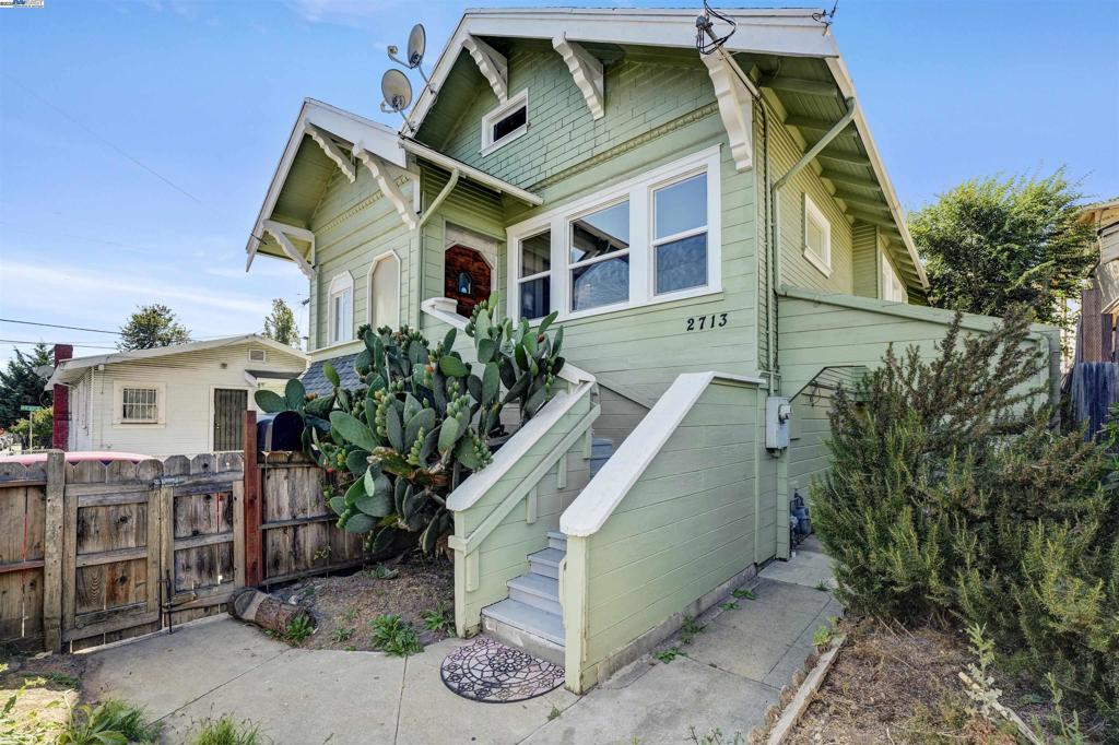 Vintage charm meets Oakland cool at 2713 Coolidge Ave. This 3 bed, 1.5 bath, 1327 sqft Craftsman isn’t trying too hard. Hardwood floors, sunshine for days, and rooms that actually let you stretch without elbowing the wall. Closets? They’re the real deal, not just “hang one jacket and hope for the best.” The living room sets the mood, but the star is the long, elegant dining room made for hosting. Holiday spreads, game nights, or impromptu taco Tuesdays, this space handles it all. Bathrooms are fresh and ready so you can move in and live, not remodel. The downstairs is your choose-your-own-adventure zone: storage, workshop, studio, or whatever your inner DIYer dreams up. Out back, the yard is a blank canvas. Build a garden, create an outdoor lounge, or keep it clean and low-key. The location is where it really flexes. You’re in a quiet pocket that still puts you minutes from Dimond and Fruitvale. Think brunch at Grand Lake Kitchen, coffee at Hasta Muerte, groceries at Farmer Joe’s, and weekend hikes at Dimond Park. The Laurel and Fruitvale neighborhoods keep you connected to shops, eats, and transit without the chaos. This isn’t just a house, it’s a lifestyle. Classic Oakland character, convenience that keeps you moving, and just the right amount of cool.