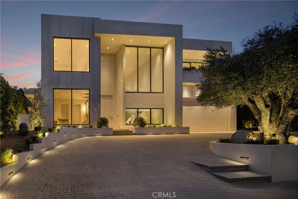 Stunning Modern Tulum-Style Masterpiece in Prime Encino Hills with EASY WESTSIDE ACCESS and VIEWS!! VERY PRIVATE!
Introducing a breathtaking new construction that embodies the essence of luxury living—a modern Tulum-style masterpiece crafted by one of Los Angeles' most sought-after builders and designed by Yeara Design Studio. This exquisite residence offers an unparalleled blend of sophistication, comfort, and style, perfect for those who seek the finest in contemporary living.
Upon entering, you are greeted by an expansive open floor plan, seamlessly integrating indoor and outdoor spaces with elegant pocket doors that invite the beauty of nature inside. The state-of-the-art media room promises cinematic experiences at home, while the sun-drenched living areas are adorned with high-end finishes and abundant natural light and stunning VIEWS!
Step outside to discover a resort-style backyard that is nothing short of a personal oasis. Dive into the sparkling outdoor pool, unwind in the soothing spa, or entertain guests under the stylish cabana complete with a full bathroom. As the sun sets, gather around the sunken fire pit, perfect for cozy evenings.
The gourmet kitchen is a culinary enthusiast's dream, featuring top-of-the-line Miele appliances, custom cabinetry, and exquisite stone finishes that exude luxury. The home offers a spacious layout with a relaxing loft on the second floor, ideal for casual gatherings or peaceful retreats.
Retreat to the master suite, where a Tulum-style spa bathroom awaits, reminiscent of a five-star hotel. With the highest grade finishes throughout, every detail has been meticulously considered, ensuring an atmosphere of tranquility and elegance.
Completing this remarkable property is a generous four-car garage, providing ample space for vehicles and storage.
Located in the prestigious Encino Hills, this home offers easy access to the vibrant Westside and is close to upscale dining, shopping, and top-rated schools. Experience the perfect blend of luxury and lifestyle in this extraordinary Tulum-style residence—where every moment feels like a getaway. Welcome home.