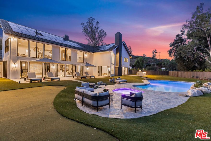 Best luxury value in Calabasas. Stunner behind gates! Showcase home like no other! When 23 luxury home brands partner with an accomplished and celebrated interior designer, the unparalleled result is nothing short of breathtaking. Renovations completed in 2022. This 7,263sqft, 5 bed, 5 bath estate, on 3.65acres behind gates, was reimagined and reinvented from top to bottom, with top of the line products and materials that solicit oohs and ahhs at every step. The combination of spacious indoor/outdoor entertaining spaces, and contemporary warmth, create an environment like no other. And did I mention the vineyard?? Too much to list, so much to see, so I will share a few highlights. 1,600sqft primary suite overlooking the heated pool and hot tub, with sitting area w/fireplace, gym, walk in closet, wet room shower tub combination and 2 water closets. Elegant formal living room w/fireplace. Great room/tasting room (with bar), separate wine cellar, home theater w/118" screen, whole house sound system, 19ft soft quartzite kitchen island, 4 wall ovens, built-in coffee maker, and separate prep kitchen. Outdoor Lynx kitchen with ForeverLawn turf w/putting green and 80yard pitch hole! 350 proprietary Grenache vines on drought tolerant drip system. Temperature controlled casita for wine storage. Purchased solar. 2 tankless water heaters. Great access to Calabasas and Malibu in the coveted enclave of Monte Nido. Calibu Vineyard is a move-in ready estate home that is poised to wow and entertain for generations. No ULA tax. Must see!