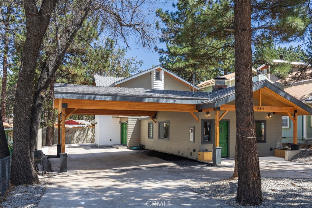 THIS IS A MUST SEE! Modern Elegance incorporated into this Total Revamp with New Addition in Sugarloaf Home. The exterior boasts a 10-foot covered porch with a cedar ceiling and elegant lighting, a durable presidential roof, and a 12-foot covered carport with glulam beams, offering space for up to seven vehicles, including boats or RVs. Inside, the first floor features an open floor plan highlighted by European white oak flooring and a striking wood-burning and gas fireplace. The kitchen is equipped with a 7-foot island, quartz countertops, soft-close white oak cabinets with under-cabinet lighting, and high-end THOR and BOSH appliances, including a 6-burner range, wall oven, and air fryer. Additional spaces include a tiled mudroom at the entrance, a side entry with French doors, a powder room, a laundry room with imported Italian tiles, and convenient storage beneath the stairs.
The master suite offers a private retreat with a walk-in closet, a bathroom featuring Italian tiles, and double sliding doors leading to the backyard. Modern upgrades throughout the home include new insulation, energy-efficient double-pane windows, recessed LED lighting, and a state-of-the-art NEST-controlled central heating and cooling system. Finishing touches, such as knotty alder doors with metal hardware, and the durable presidential roof, add charm and lasting quality to this elegant and functional home.