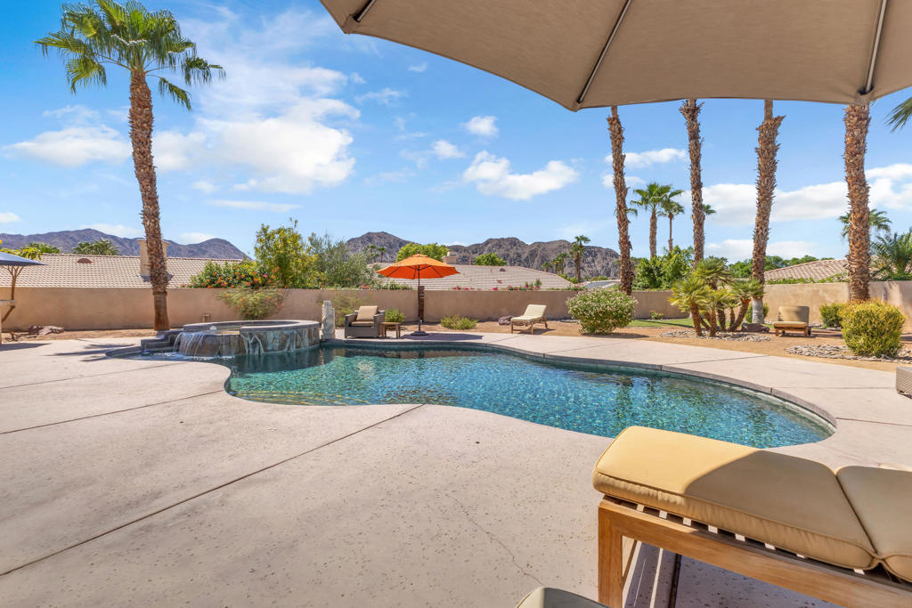 Welcome to Lake La Quinta--a prestigious gated community offering resort-style living with a private 25-acre lake, perfect for kayaking, boating, and fishing. This exclusive community is uniquely attached to the luxury boutique hotel The Chateau and offers residents an unparalleled lifestyle experience.Amenities include a lakeside park, tennis and pickleball courts, an exclusive BBQ area with a heated pool and spa, and a vibrant social calendar featuring book clubs, wine parties, and more. Residents also enjoy convenient access to the community's acclaimed Melange restaurant.Set on an oversized lot with coveted south-facing views, this three bedroom, two bathroom home has been beautifully updated and provides ultimate privacy and a seamless indoor-outdoor lifestyle. The backyard is an entertainer's dream, complete with a built-in BBQ, sparkling private pool and spa, putting green, and lush mature landscaping.Inside, you'll find a renovated kitchen and bathrooms, two spacious living areas, and a large primary suite with generous closet space. Additional highlights include ample storage, a cozy fireplace for cool desert evenings, a welcoming front courtyard, and a rare three-car garage for both functionality and style.Whether you're seeking a year-round residence or a luxurious desert retreat, this Lake La Quinta gem blends modern upgrades, resort amenities, and an unbeatable location. Sold Turnkey furnished per Seller's inventory list! Call today for a private showing.