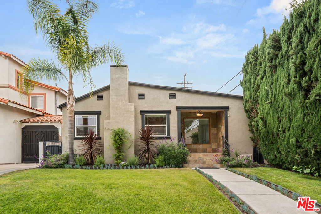 Tucked away in the desirable south Beverly Hills neighborhood, this rare single-story residence offers timeless charm, thoughtful upgrades, and endless potential. Featuring 4 bedrooms and 2 bathrooms, the floor plan offers versatility--one of the bedrooms can easily be used as a home office, guest room, or creative space to suit your lifestyle. The spacious living area is anchored by rich hardwood floors and a cozy fireplace, flowing seamlessly into the dining area and updated kitchen. A mix of modern design and warm materials, the kitchen features stainless steel appliances, dark walnut cabinetry, granite countertops, and elegant glass tile accents. Bathrooms offer luxurious touches including a jetted tub and designer Hinkley lighting. Outside, the private backyard feels like a hidden oasis--lush landscaping, mature fruit trees, and plenty of space for outdoor dining or relaxing under the stars. The detached garage presents a prime opportunity for an ADU conversion--perfect for a guest house, home office, or additional income stream. Located within the prestigious Beverly Hills Unified School District and just moments from iconic shopping, fine dining, Roxbury Park, and Century City, this home combines lifestyle and location in one of LA's most sought-after neighborhoods. A rare opportunity to own a turnkey property with space to grow in the heart of Beverly Hills.