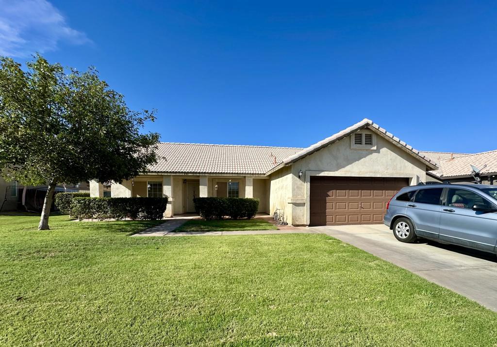 Charming Single-Story Home with Spacious Backyard and SunroomWelcome to this inviting 3-bedroom, 2-bath home featuring a bright, open layout and plenty of updates. The kitchen is complete with granite counters, stainless steel appliances, and crisp white cabinetry. Vaulted ceilings and abundant natural light flow through the living areas, highlighting the wood-look and tile flooring throughout.The spacious primary suite offers comfort, walk in closet, dual sinks and access to the backyard, while both bathrooms are designed with generous counter space and updated finishes. An enclosed sunroom adds versatile living space--perfect for a playroom, workout area, or entertainment.Step outside to enjoy a large backyard with a covered patio, lush lawn, and mature trees--ideal for gatherings, gardening, or simply relaxing. The property also includes a 2-car garage and wide driveway for convenience.Located in a desirable neighborhood near schools, shopping, and easy freeway access, this home is move-in ready and full of potential.