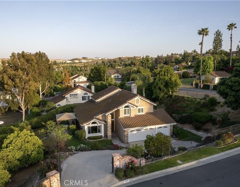 Welcome home to 16390 Whiteblossom Cir, Riverside 92503 Located in a prestigious area in the La Sierra Hills. This is a community of homes on large lots with beautiful views of the hills. You will love the feel of peaceful and privacy this home offers. The home has almost ½ acre of land with many fruit trees, such as oranges, grapefruits, and apples. This house features 4 bedrooms and 3 bathrooms, with a downstairs bedroom that has a full bathroom for your convenience. The property is very private and fence throughout. The beautiful landscape surrounding the home adds a peaceful feeling allowing you to escape from the busy city vibes. This home is ready to be occupied and very close to schools, shopping, dining and convenient public transportation.