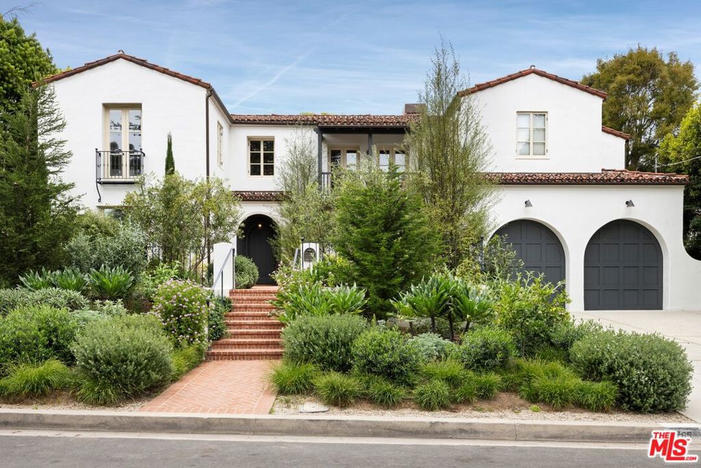 Exceptional design and an unbeatable location in the heart of Rustic Canyon. Nestled on a prime street, this sun-filled custom residence exudes warmth and sophistication. Built by Morrow & Morrow and designed by Steve Gianetti, this home features soaring ceilings, natural textures, a soothing color scheme and an intentional layout that flows seamlessly into serene outdoor living areas. Native landscaping harmonizes with the home's architecture and the surrounding canyon. The main floor showcases a striking living and dining space, a tucked-away office for quiet work, a cozy eat-in kitchen, a spacious mudroom with direct access to the two-car garage, and a separate guest room with its own private entry. A few steps above, the secluded primary suite opens out to a lush lawn, pool and a tranquil path leading to a private cedar soaking tub. Upstairs offers flexibility with up to four additional bedrooms, two of which have been converted to an additional office and media room. A broad, light-filled hallway overlooks the main level and connects to a romantic balcony with views of the front garden. Crafted with exquisite finishes and interiors by Nickey Kehoe, this home delivers incredible ambiance while still being conveniently located near the best of the Westside and top-rated schools. A rare chance to own a property that combines elegance, location and architectural integrity. Access via Sunset now available.