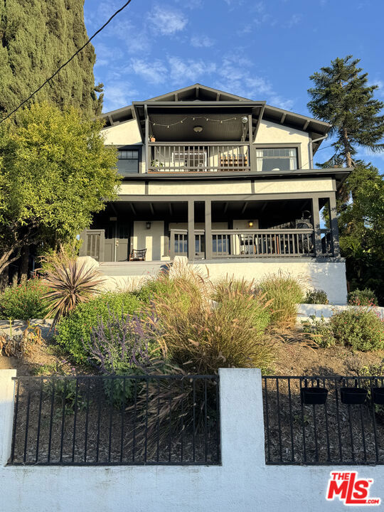 1322 Waterloo Street is a beautifully preserved 1909 Craftsman duplex perched on a hill between Silver Lake and Echo Park, offering sweeping views of the Hollywood Hills and iconic Hollywood Sign. This expansive property includes two large units a 3-bed + bonus room upstairs with a covered deck, and a 3-bed, 2-bath downstairs unit with original built-ins and spacious living areas. Located on a nearly 7,500 sq ft lot, it also features gated alley access and off-street parking. The home blends historic charm with modern flexibility, ideal for multi-generational living, rental income, or creative work-from-home setups.Just minutes away are Echo Park Lake, Silver Lake Reservoir, and scenic trails, making it easy to enjoy outdoor recreation. The neighborhood is known for its walkability, vibrant arts scene, and an eclectic mix of coffee shops, bars, restaurants, and boutiques. Residents enjoy the energy of city life with the comfort of a residential hillside setting. If you're looking for character, space, and a prime Eastside location, this one-of-a-kind property delivers it all.