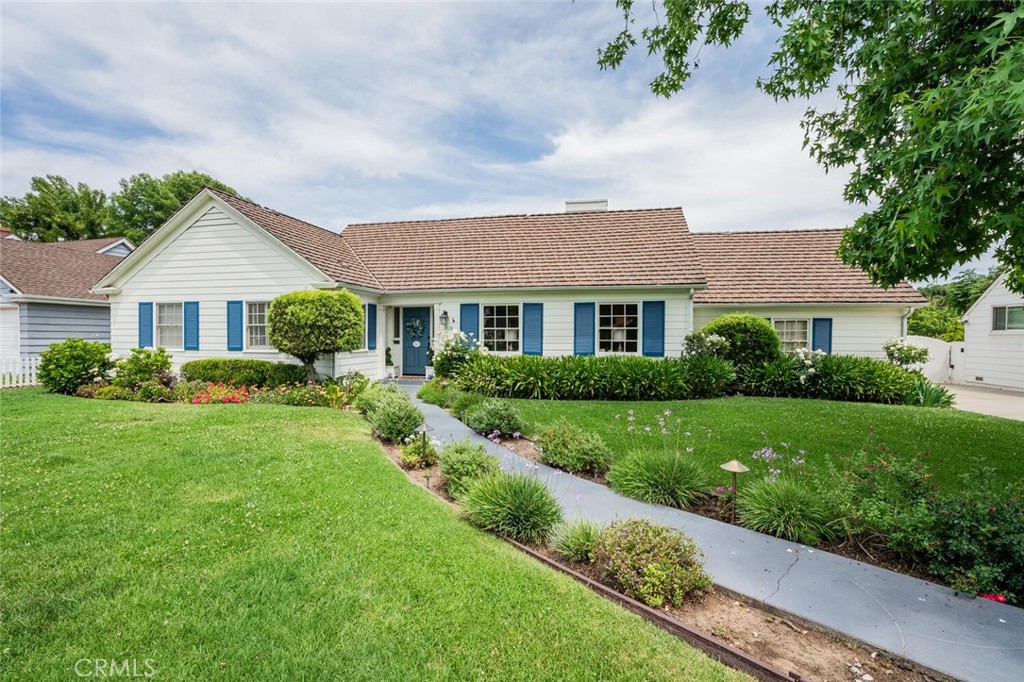 Nestled in the prestigious Midvale Estates, this expansive Mid-Century residence sits on nearly half an acre of beautifully landscaped grounds. Ideally located in the heart of Midvale, the home has long been a favorite filming location, celebrated for its timeless charm and character.
A picturesque brick walkway, framed by blooming roses and manicured lawns, leads to the entrance. The impressive backyard is designed for both grand entertaining and everyday enjoyment, having hosted numerous neighborhood gatherings, including annual holiday celebrations. Outdoor amenities include a spacious cabana, a large swimming pool, multiple alfresco dining areas, and dedicated zones for children’s activities.
The interior features five bedrooms and four bathrooms, including a private primary en-suite in the south wing. The north wing offers three additional bedrooms and two baths. A generous living room, a vintage-inspired family room with wood flooring, and a separate maid’s quarters with an adjacent laundry room complete the layout.
This is a rare opportunity to own a landmark home in one of the Valley’s most desirable neighborhoods.
The potential is unlimited for this Estate.
Nearby there are great Eateries, markets, Costco, parks, 3 golf courses, biking, gyms, Lake Balboa and more.