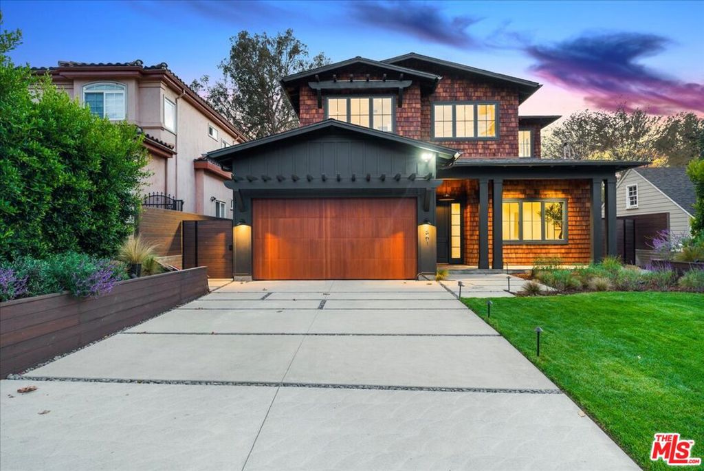 Location matters. Perfectly positioned in the heart of Brentwood, this brand-new 4,064-square-foot residence set on a generous 7,541-square-foot lot defines modern California living: a seamless blend of timeless design, thoughtful functionality, and refined sophistication. The home opens with soaring 11-foot ceilings and expansive French white oak floors that create warmth and openness throughout. The main level features a formal living room, an elegant dining area, and an inviting kitchen and family room that seamlessly connect for effortless entertaining and everyday living. The layout flows beautifully from the dining room connected by a butler's pantry into a stunning open-concept kitchen and family room. The chef's kitchen showcases a large Sub-Zero refrigerator with bottom freezer, Wolf appliances, a farm sink, built-in microwave within the island, a prep sink, and space for a second dishwasher. The family room, framed by custom built-in cabinetry, opens through French doors to a covered patio and an expansive, lush backyard a huge grassy retreat perfect for kids to run, play, and enjoy outdoor living. The space is framed by mature landscaping and a stately olive tree, creating a private and serene setting. Also on the main floor is a private office or guest suite with ensuite bath, a dedicated powder room, and a wraparound storage or AV closet beneath the staircase ideal for luggage or seasonal items. Upstairs, a floating loft serves as a versatile hybrid space fully wired for media and ideal as an office, gym, or reading retreat. Three spacious bedrooms include a full laundry room with LG washer/dryer, sink, and custom cabinetry. The primary suite features vaulted ceilings, two walk-in closets (one massive, one generous), and a spa-like bathroom with dual vanities, soaking tub, oversized shower with bench, and sleek built-ins. French doors open to a private stone-covered balcony overlooking mature eucalyptus trees and tranquil treetop vistas. Built with uncompromising attention to quality, the construction is exceptional throughout. Lightweight concrete beneath the French white oak flooring provides superior sound insulation and structural integrity. A four-zone HVAC system ensures personalized comfort, while dual tankless water heaters offer efficiency and convenience. Fire-retardant shingles and concrete siding, all pre-treated for fire resistance, deliver lasting peace of mind. This rare Brentwood opportunity combines privacy, sophistication, and convenience in one of the city's most desirable neighborhoods. Enjoy the very best of Brentwood living from top-rated schools and tree-lined streets to upscale shops, dining, cafs, and Whole Foods just minutes away. The perfect fusion of design excellence, quality craftsmanship, and lifestyle.