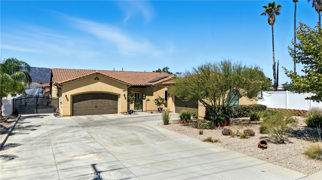 Spacious One-Story Home on HALF ACRE LOT | 3,006 SQ FT | 4 Bed, 4 Bath | RV Parking | 4 car garage | NO HOA
Built in 2016, this expansive single-story home sits on a generous half-acre lot, offering the perfect blend of space, comfort, and modern convenience. With 4 oversized bedrooms and 4 full bathrooms, there’s room for everyone to spread out in style. The open-concept living area is bright and inviting, anchored by a cozy fireplace and framed by double sliding glass doors that flood the space with natural light and create a seamless flow to the outdoors. The gourmet kitchen is a chef’s dream, featuring a huge center island, stainless steel appliances, and plenty of room to gather and entertain. Outside, enjoy your private retreat with an above-ground pool, perfect for cooling off during warm days. There’s ample parking with a 4-car garage, plus RV parking with a dedicated dump station—a rare and valuable feature for adventurers or guests. With modern construction, an ideal layout, and exceptional outdoor amenities, this home offers the perfect mix of luxury, functionality, and space all on one level. Close to the 15 Freeway and shopping centers! Make your appointment before its gone!
