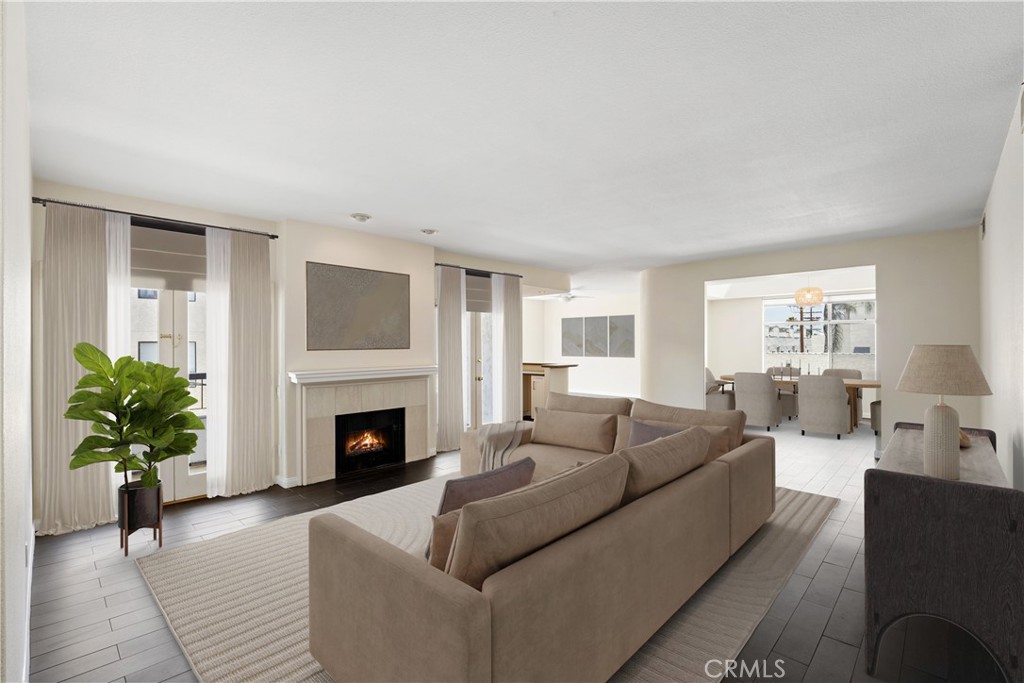 Phenomenal South of the Boulevard condo close to all the trendy shops and restaurants along Ventura Blvd & amazing access to the Westside & major transportation hubs! Quiet sun filled rear corner unit offers a spacious flexible floor plan with nearly 2300 sq ft of upscale space. The 2 bedroom 2.5 bath condo is enhanced by an open concept layout with porcelain wood floors and common rooms that include a massive living room with gas fireplace flanked by French doors to a quaint private balcony, a lovely den with bar, formal dining room, and a remodeled galley kitchen with cheerful breakfast room, ample cabinetry & quartz counters. There are two ensuite bedrooms; the master with a walk-in closet, dual banks of wall closet space, rain-head shower, jetted tub, dual sinks and the secondary bedroom that both have access to a shared balcony. Other in unit amenities include a nest thermostat, powder room & in unit laundry. Complex amenities include an indoor pool, spa & gym. Water is included. The unit is Unfurnished