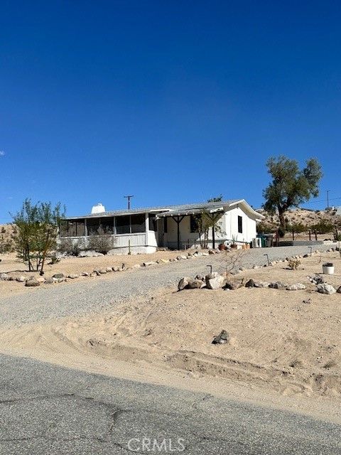 Photo of 6597 Mesquite Springs, 29 Palms, CA 92277 (MLS # OC26119752)