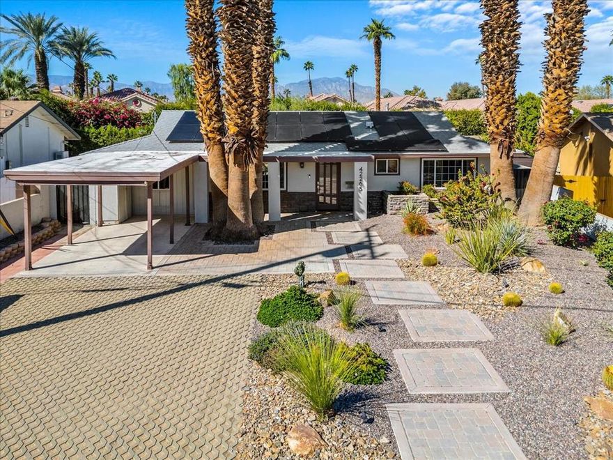 Welcome to your desert oasis in the desirable Palm Desert Country Club! This beautifully updated 3 bedroom, 2 bath home features an open floor plan, perfect for entertaining or relaxing. The modern kitchen flows seamlessly into the living area, and a cozy desk nook adds extra functionality. Enjoy resort-style living with a sparkling pool and spa, desert landscaping, pavers, uplighting, and a stunning fire pit -- all set against breathtaking mountain views. The oversized backyard (over 6,500 sq. ft.) offers plenty of space to relax or host. The primary suite includes a walk-in closet and a spa-inspired rain shower. Additional features include Luxury Vinyl Plank flooring, interior washer & dryer, Nest system, and leased solar panels for energy efficiency.  HOA's only $33/month! This property is being sold turnkey furnished, making it ideal as a full-time residence, second home, or an excellent rental opportunity. Centrally located near the The Living Desert Zoo and Gardens, McCallum Theatre, El Paseo Shopping District, and Interstate 10. Don't miss your chance to own this move-in ready Palm Desert retreat!