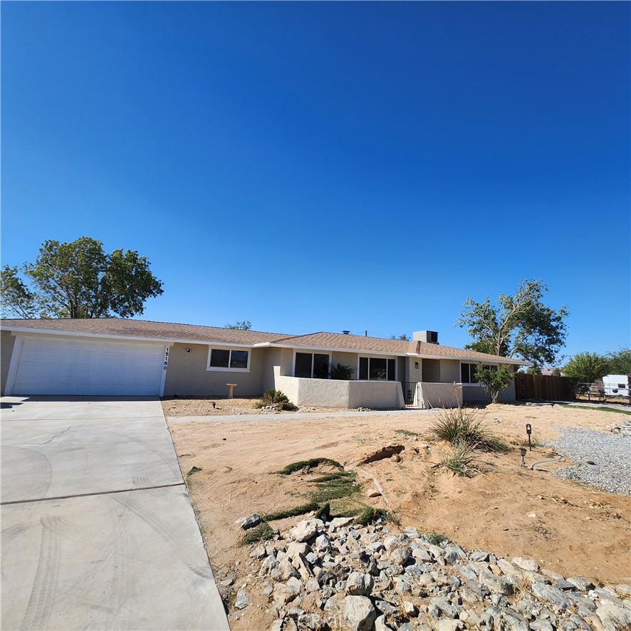APPLE VALLEY 4 BEDROOM, 2 BATH HOME RECENTLY UPDATED WITH NEW KITCHEN, QUARTZ COUNTERTOPS, HUGE FARM SINK, 2 CAR ATTACHED GARAGE + 4 CAR DETACHED GARAGE IN A NICE AREA. THE PROPERTY IS LARGE ENOUGH FOR HORSES, CHICKENS OR OTHER LIVESTOCK. THE 4 CAR DETACHED GARAGE WAS JUST FINISHED WITH NEW WINDOWS, DRYWALL AND HAS 2 ROLL UP DOORS FOR BOATS OR RV'S. THE OPEN FLOOR PLAN INCLUDES NEW FLOORING, STONE FIREPLACE IN THE LIVING ROOM, LARGE INDOOR LAUNDRY ROOM, NEW STAINLESS APPLIANCES, AND MUCH MORE. THE PRIMARY BEDROOM HAS A WALK IN CLOSE, WALK IN SHOWER AND NEW BATHROOM VANITY AND QUARTZ COUNTERTOPS. HALL BATH WAS ALSO UPGRADE AND THE HOME IS MOVE IN READY. THE COVERED BACK PATIO EXTENDS MOST OF THE HOME AND IS A PERFECT QUIET PLACE FOR HOSTING BACKYARD FAMILY GATHERINGS.