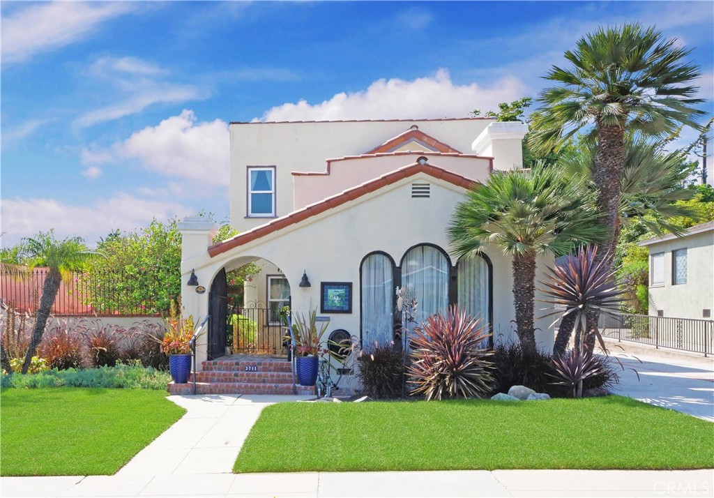 Introducing a rare Spanish-style gem in the highly sought-after Palisades coastal community of San Pedro, just steps from the bluffs of Paseo Del Mar and the Pacific Ocean. This three-bedroom, two-bathroom split-level unique home embraces 1,885 square feet of charm, character, and timeless elegance situated on a sizable, flat 7,504 square foot lot. The dramatic formal living room boasts soaring ceilings, vintage chandelier, and hardwood floors, while the sun-filled adjacent dining room overlooks the lush yard—perfect for visiting with family and friends. The remodeled kitchen features ample custom cabinetry, handcrafted tile backsplash, and convenient interior laundry room off the kitchen with a newer stack washer and dryer. The first-floor bedroom is spacious featuring a large closet and adjacent remodeled downstairs bathroom showcasing an oversized walk-in shower with classic handcrafted tile accents. Upstairs, two large bedrooms highlights walk-in closets, additional storage space, and peek-a-boo ocean views. A beautifully remodeled hall bathroom with tub/shower completes the upper level. Step outside to your secluded and expansive park-like backyard rendering to gentle ocean breezes. A covered patio with built-in overhead lighting invites year-round serene relaxation or enjoyable entertaining. Additional features include air conditioning, hard wood floors, custom window treatments, recessed lighting, new sod in the front yard, a long driveway to park additional cars, a two-car garage, and ample storage. Enjoy coastal living with nearby White Point Nature Preserve, Royal Palms, Point Fermin Park & Lighthouse, Fort Mac Arthur Museum, Angels Gate Cultural Center, Korean Friendship Bell, and the Tidepools below the Ocean Bluffs. Don’t miss this rare opportunity to own a piece of San Pedro’s Palisades charm!