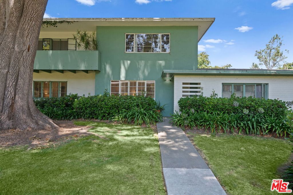 PRISTINE, ample & full of natural light with direct access to a grassy courtyard and 64 acres of lush grounds. Secluded in Court 15, this beautiful condo offers in-unit laundry, remodeled, kitchen and bathroom, custom shutters, all new paint, hardwood floors, and a private patio and garage for one car. Learn more about this National Historic Landmark and Monument at www.villagegreenla.net and ask about the significant property tax benefits thank to the Mills Act. Live inside an urban forest minutes from trendy Culver City, West Adams, 2 Expo-lines, Whole Foods, LAX, and lots of dining and shopping options!