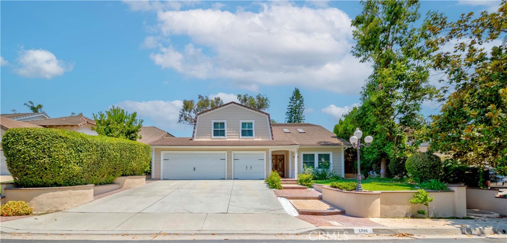 Discover your dream home at 1748 Peacock Lane Fullerton CA.
Located on a quiet tree-lined street in Fullerton, across the street from the community's greenbelt park with walking trails and playground, this charming "Peppermill Run" home welcomes you through the elegant double door entry. Vaulted beamed ceilings with skylight bring a sense of spaciousness and a light and bright elegance.
Step inside to discover this 2 story 4-bedroom 2.5 bath, featuring an open concept living space bathed in natural light.
Enjoy cooking in your beautifully remodeled kitchen featuring quartz countertops, stainless steel appliances with custom cabinetry, two large islands
perfect for gathering. kitchen overlooks the family room with newly upgraded fireplace.
Relax in the master bedroom complete with 2 closets and spa quality en-suite bathroom featuring dual sinks, a soaking tub, and separate shower.
Additional upgrades include new tiles throughout, window shutters recessed lighting. Backyard hosts a covered patio and quaint gazebo for your entertainment needs. Attached 3 car garage. No Mello Roos and low HOA Fee $180/month. Newly upgraded electric panel, installed EV charging station. Award winning Schools: Laguna Roads Elementary, Parks junior high, and Sunny Hills High.
Don't miss this rare opportunity to own an exquisite Fullerton property that combines style, comfort, and convenience.